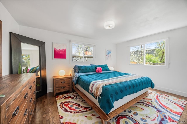 1380 S Dahlia St, Denver, CO 80222 - bedroom featuring dark wood-type flooring, baseboards, and multiple windows