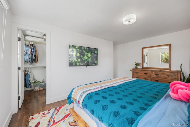 1380 S Dahlia St, Denver, CO 80222 - bedroom featuring a walk in closet, wood finished floors, a closet, and baseboards