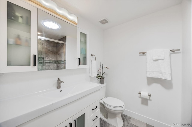 1380 S Dahlia St, Denver, CO 80222 - bathroom featuring a shower stall, vanity, baseboards, toilet, and visible vents