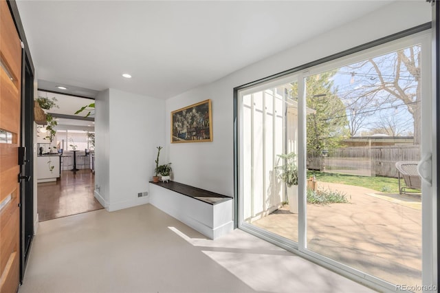 1380 S Dahlia St, Denver, CO 80222 - doorway featuring baseboards, concrete flooring, visible vents, and recessed lighting