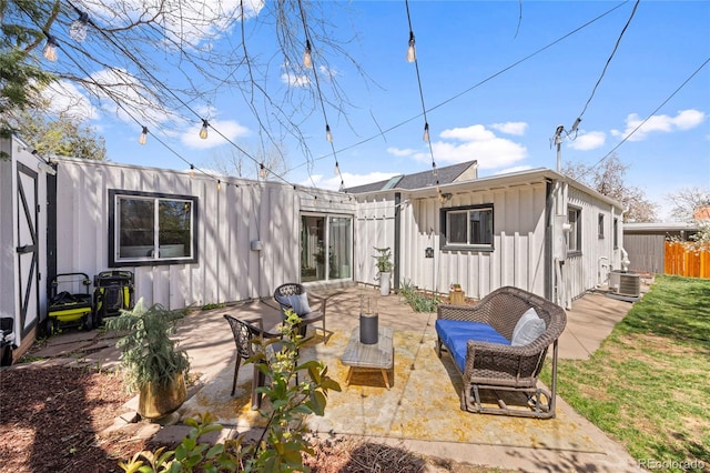 1380 S Dahlia St, Denver, CO 80222 - rear view of house with board and batten siding, a patio area, fence, and central air condition unit