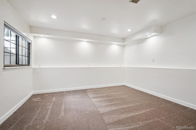 below grade area featuring carpet, baseboards, and recessed lighting