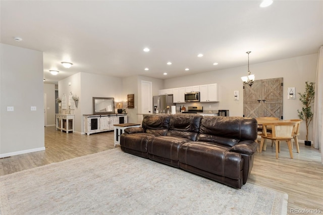 1108 Huntington Ave, Dacono, CO 80514 - living room featuring light wood-style flooring and recessed lighting