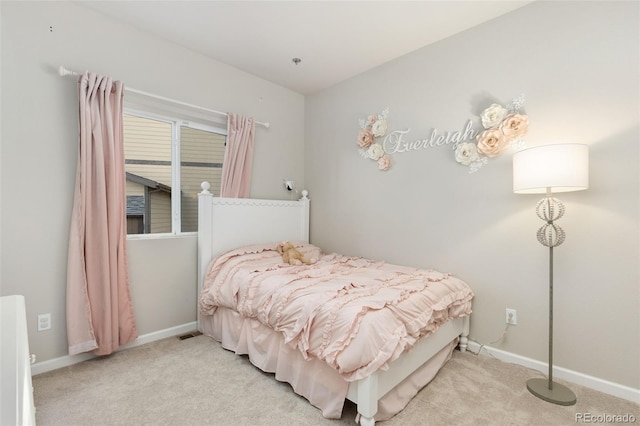1108 Huntington Ave, Dacono, CO 80514 - carpeted bedroom featuring baseboards