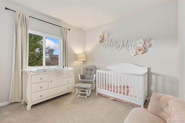 1108 Huntington Ave, Dacono, CO 80514 - bedroom featuring light colored carpet and a crib