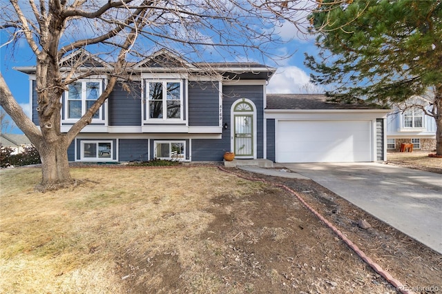 view of front of property with a garage and a front yard