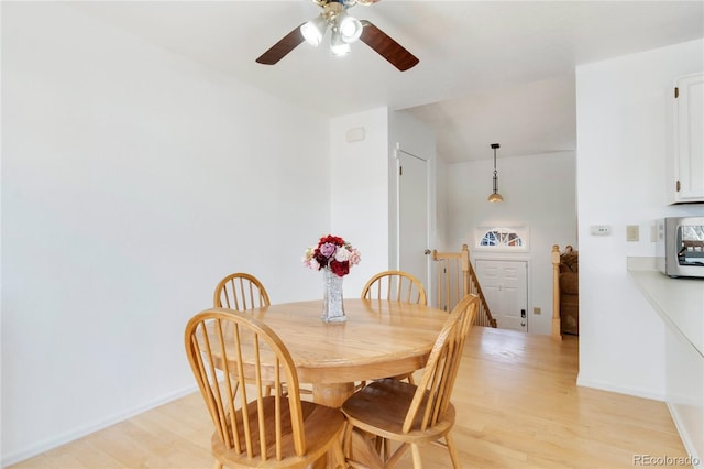 dining space with light wood-type flooring