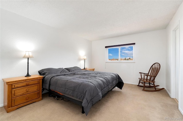 carpeted bedroom with a textured ceiling