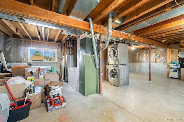 basement featuring gas water heater and stacked washer and clothes dryer