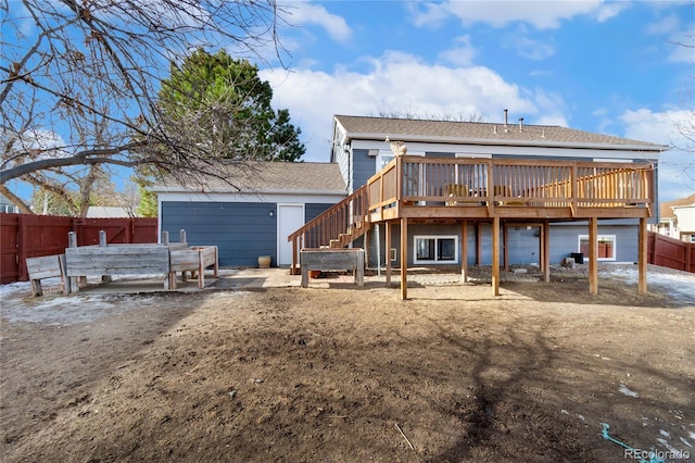 back of property featuring a wooden deck