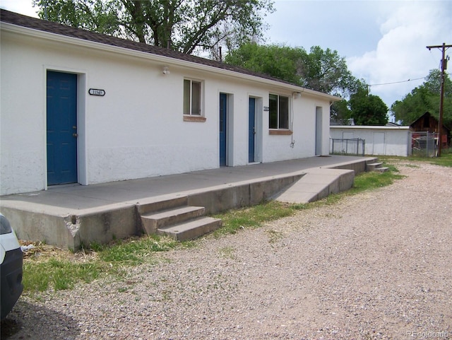 11549 Frederick St, Fort Lupton, CO 80621 - rear view of property with stucco siding