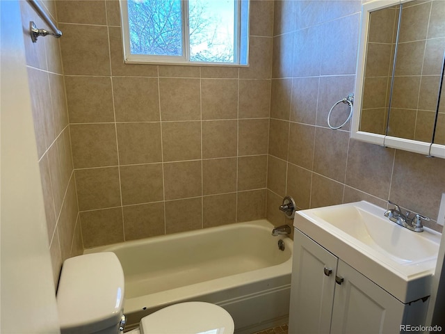 11549 Frederick St, Fort Lupton, CO 80621 - full bathroom with toilet, vanity,  shower combination, and tile walls