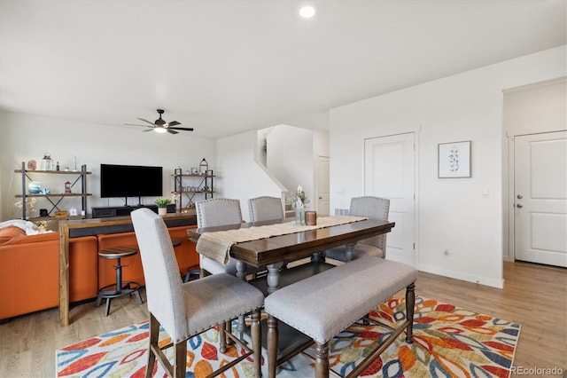 353 Raven Ln, Johnstown, CO 80534 - dining area featuring light wood-style flooring, a ceiling fan, and baseboards