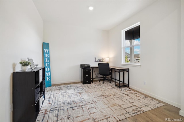 353 Raven Ln, Johnstown, CO 80534 - office area with wood finished floors, baseboards, and recessed lighting
