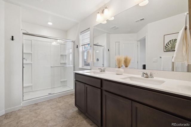 353 Raven Ln, Johnstown, CO 80534 - bathroom featuring double vanity and a shower stall