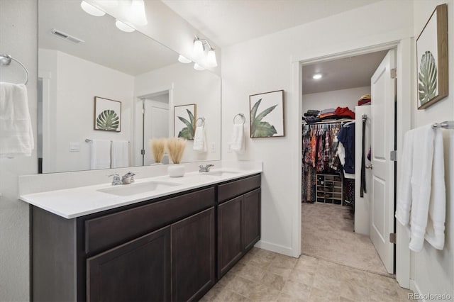 353 Raven Ln, Johnstown, CO 80534 - full bath featuring double vanity, a spacious closet, and baseboards
