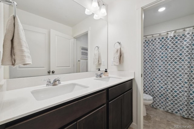 353 Raven Ln, Johnstown, CO 80534 - bathroom featuring double vanity, toilet, and a shower with curtain