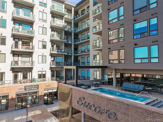 view of pool featuring a hot tub