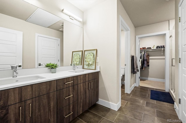 bathroom with vanity, tile patterned floors, and toilet