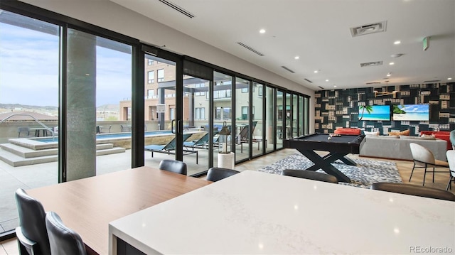 interior space with light tile patterned flooring and billiards