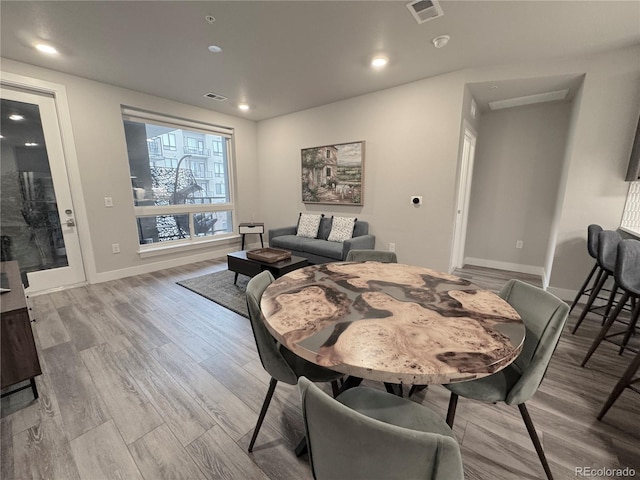 20 Wilcox St Unit 517, Castle Rock, CO 80104 - dining space featuring wood finished floors, baseboards, and recessed lighting