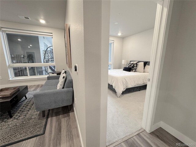 20 Wilcox St Unit 517, Castle Rock, CO 80104 - bedroom featuring wood finished floors, baseboards, and recessed lighting