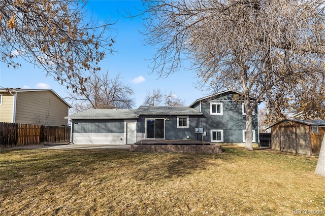 back of property with an outdoor structure, a patio area, a lawn, and a storage shed