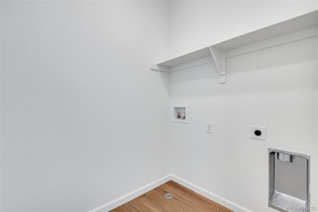 washroom with wood-type flooring, washer hookup, and hookup for an electric dryer