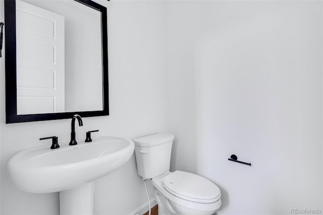 bathroom with toilet and sink