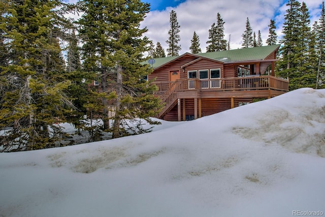 492 Kimmes Ln, Breckenridge, CO 80424 - back of property featuring log veneer siding, stairs, and a wooden deck