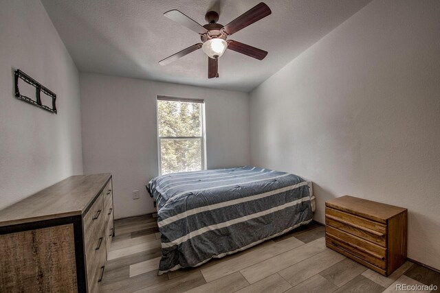 492 Kimmes Ln, Breckenridge, CO 80424 - bedroom featuring light wood-style flooring and ceiling fan