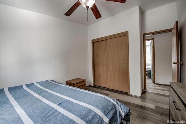 492 Kimmes Ln, Breckenridge, CO 80424 - bedroom featuring wood finished floors, a ceiling fan, and a closet