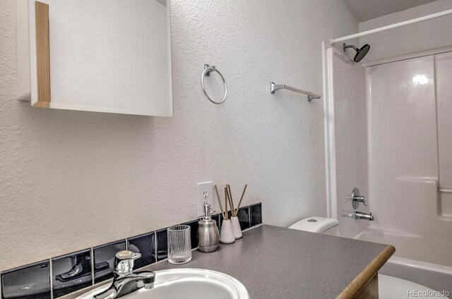492 Kimmes Ln, Breckenridge, CO 80424 - bathroom with a textured wall, shower / tub combination, vanity, and toilet