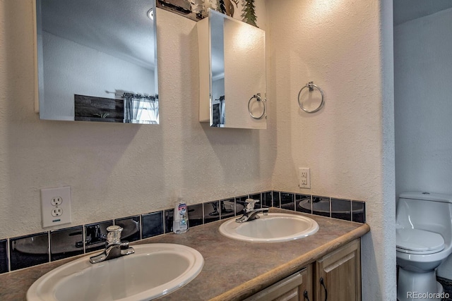 492 Kimmes Ln, Breckenridge, CO 80424 - bathroom with a textured wall, toilet, and double vanity