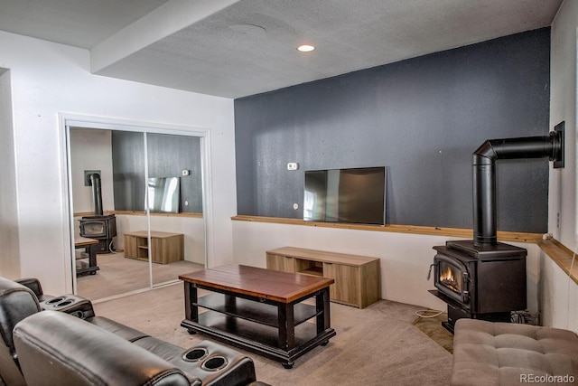492 Kimmes Ln, Breckenridge, CO 80424 - living room with a wood stove, carpet floors, a textured ceiling, and recessed lighting