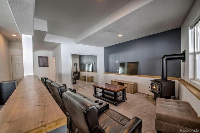 492 Kimmes Ln, Breckenridge, CO 80424 - living area with a wood stove, healthy amount of natural light, carpet floors, and recessed lighting
