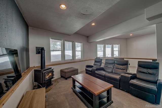 492 Kimmes Ln, Breckenridge, CO 80424 - living area with carpet floors, a wood stove, a textured ceiling, and recessed lighting