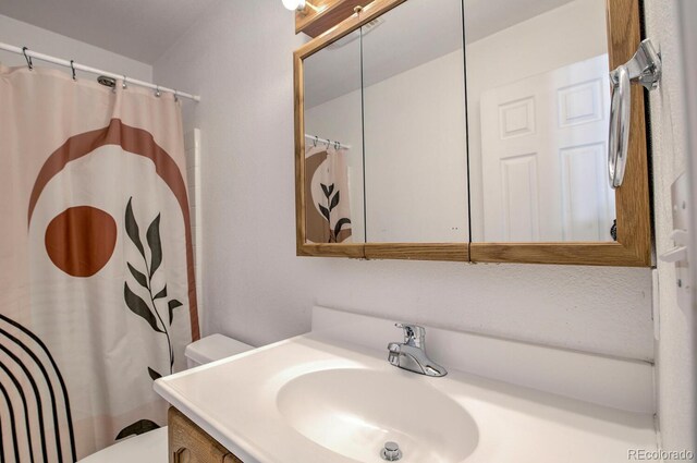 492 Kimmes Ln, Breckenridge, CO 80424 - bathroom with vanity, toilet, and a shower with curtain