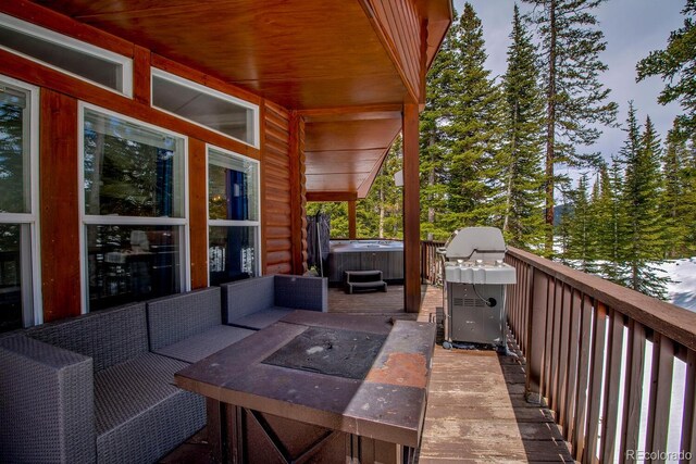 492 Kimmes Ln, Breckenridge, CO 80424 - deck featuring a hot tub, grilling area, and an outdoor hangout area