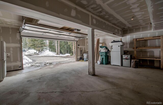 492 Kimmes Ln, Breckenridge, CO 80424 - garage featuring freestanding refrigerator