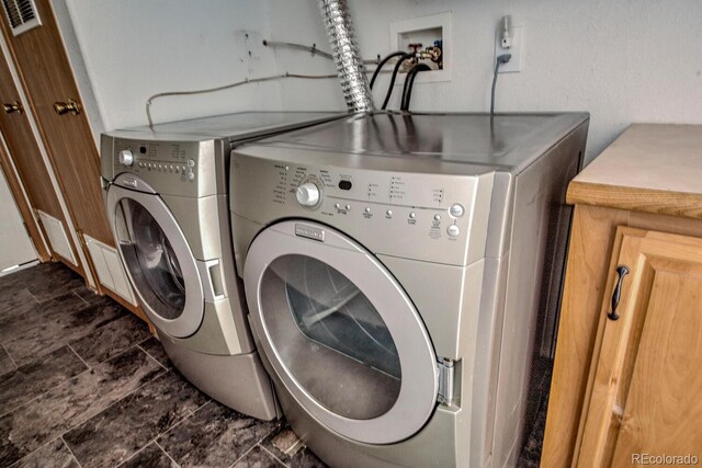 492 Kimmes Ln, Breckenridge, CO 80424 - washroom with separate washer and dryer and cabinet space