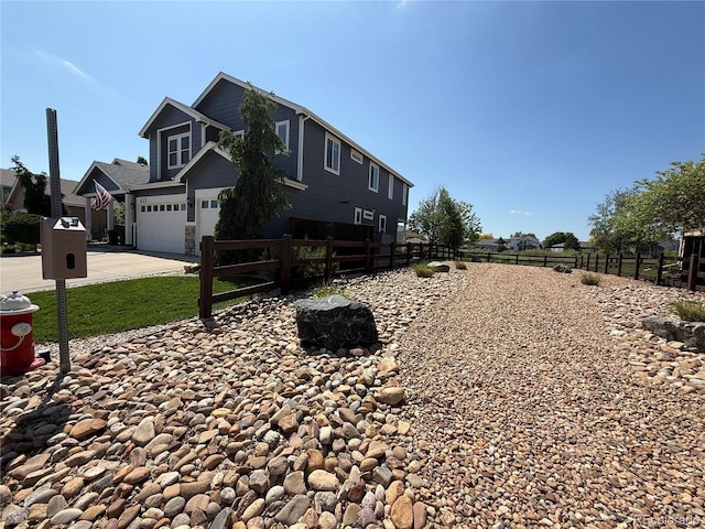 653 Glenarbor Cir, Longmont, CO 80504 - view of side of home featuring driveway and an attached garage