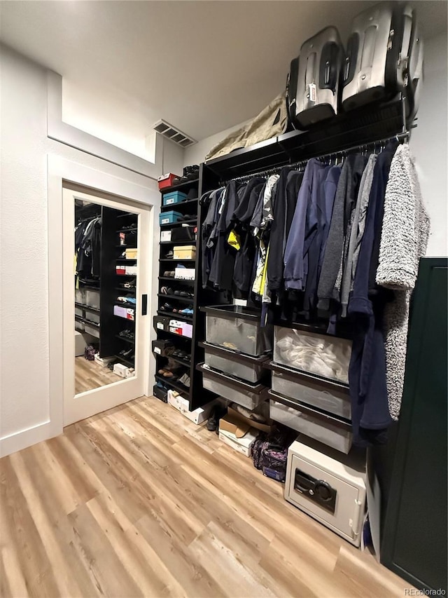 653 Glenarbor Cir, Longmont, CO 80504 - spacious closet featuring wood finished floors