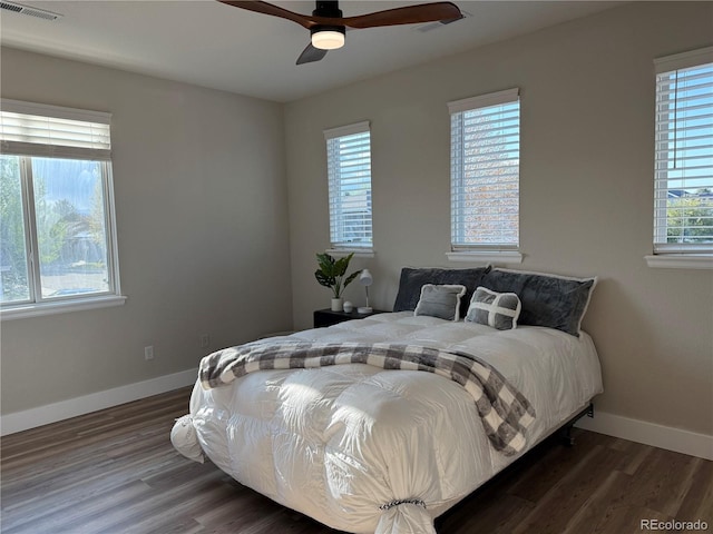 653 Glenarbor Cir, Longmont, CO 80504 - bedroom with wood finished floors, baseboards, and ceiling fan