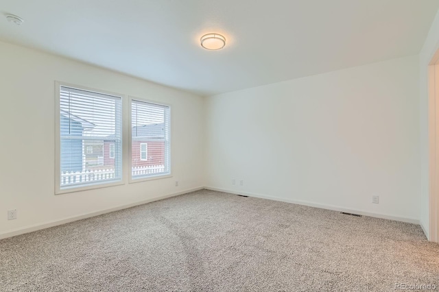 6261 Red Cedar St, Frederick, CO 80530 - unfurnished room with baseboards, visible vents, and light colored carpet