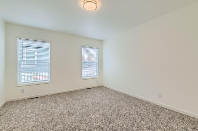 6261 Red Cedar St, Frederick, CO 80530 - empty room featuring carpet flooring, visible vents, and baseboards