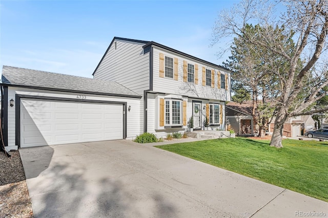 4733 S Vivian Ct, Morrison, CO 80465 - colonial home featuring concrete driveway, an attached garage, a front lawn, and a shingled roof