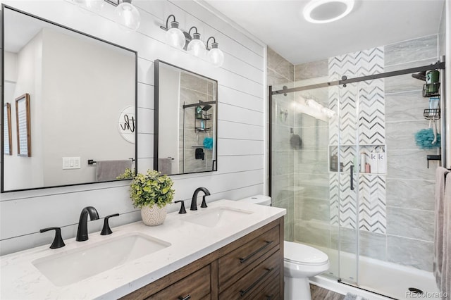 4733 S Vivian Ct, Morrison, CO 80465 - full bathroom featuring toilet, double vanity, and a shower stall