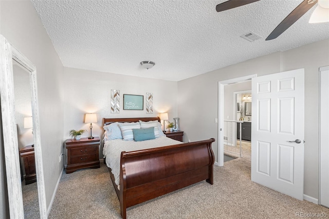 4733 S Vivian Ct, Morrison, CO 80465 - bedroom featuring light colored carpet, baseboards, ceiling fan, and a textured ceiling