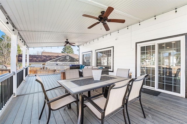 4733 S Vivian Ct, Morrison, CO 80465 - wooden terrace with ceiling fan, outdoor dining area, and an outdoor living space